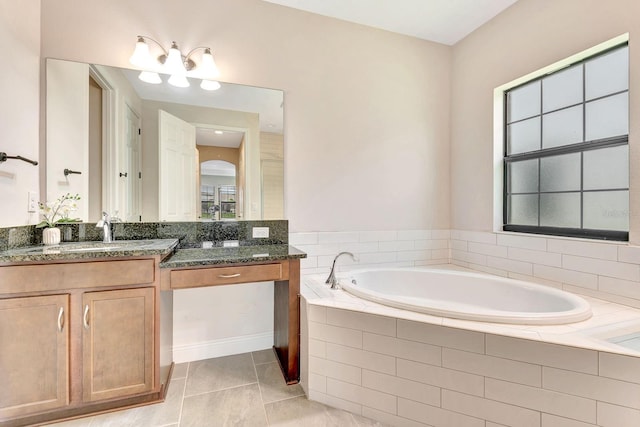 9215 Isabella Cir, Parrish, FL 34219 - full bath featuring vanity, a garden tub, and tile patterned floors