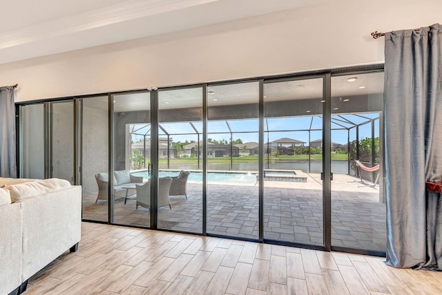 9215 Isabella Cir, Parrish, FL 34219 - entryway with a sunroom, wood finished floors, and healthy amount of natural light