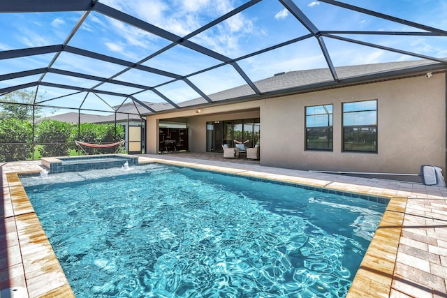 9215 Isabella Cir, Parrish, FL 34219 - view of swimming pool featuring a patio, a pool with connected hot tub, and glass enclosure