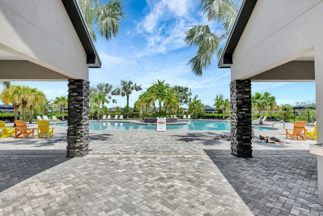 9215 Isabella Cir, Parrish, FL 34219 - community pool featuring a patio