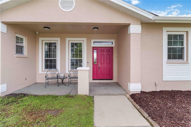 9410 71st Ave E, Palmetto, FL 34221 - property entrance featuring stucco siding and covered porch