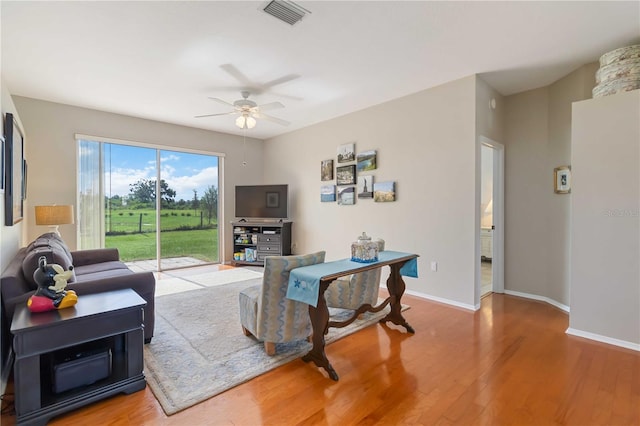 9410 71st Ave E, Palmetto, FL 34221 - living area featuring a ceiling fan and wood finished floors