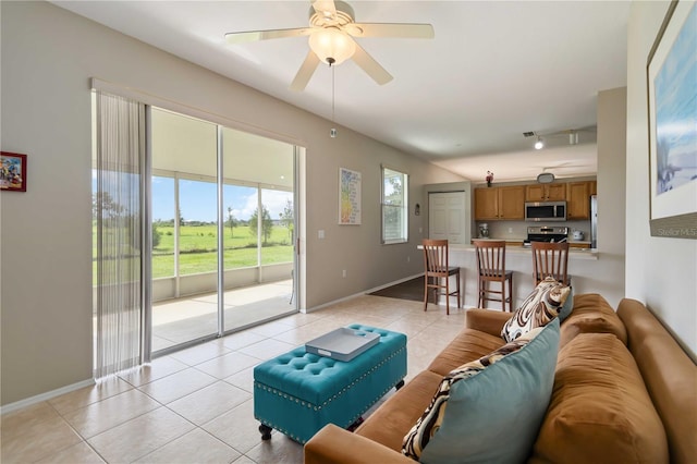 9410 71st Ave E, Palmetto, FL 34221 - living room featuring light tile patterned floors and ceiling fan
