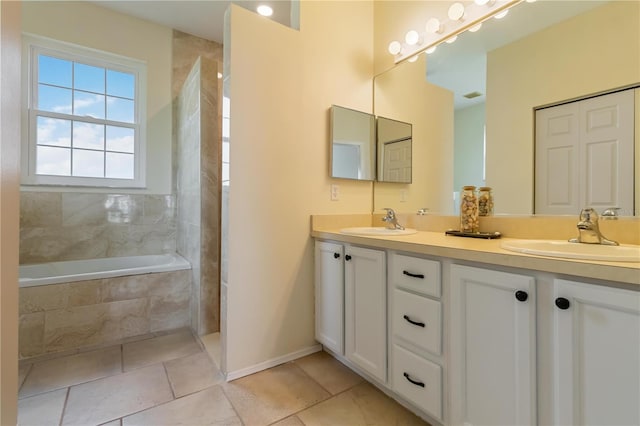 9410 71st Ave E, Palmetto, FL 34221 - bathroom with tile patterned flooring, double vanity, and tiled shower / bath