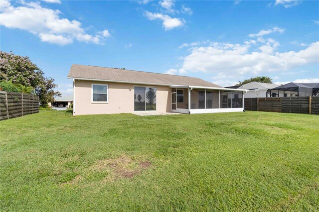 9410 71st Ave E, Palmetto, FL 34221 - back of property with a sunroom and stucco siding