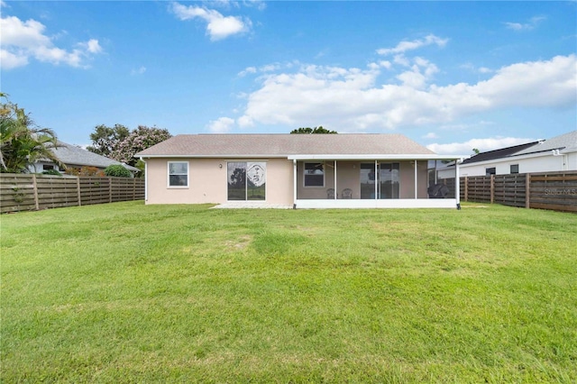 9410 71st Ave E, Palmetto, FL 34221 - rear view of property with a sunroom, a fenced backyard, and stucco siding