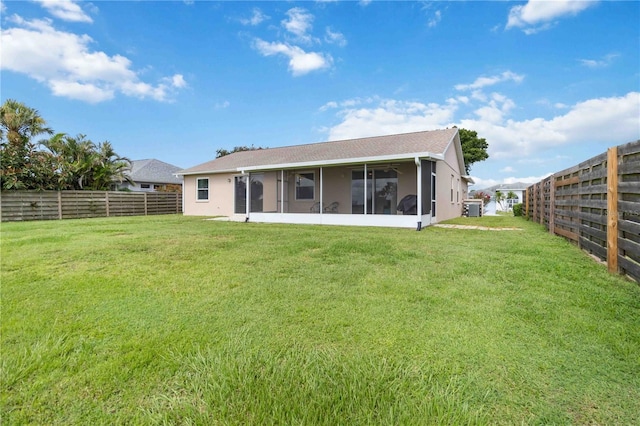 9410 71st Ave E, Palmetto, FL 34221 - back of property with a sunroom and a fenced backyard