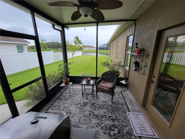 2819 47th St E, Palmetto, FL 34221 - sunroom / solarium featuring a water view, healthy amount of natural light, and ceiling fan