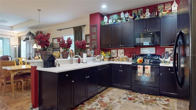 2819 47th St E, Palmetto, FL 34221 - kitchen featuring black appliances, light countertops, a peninsula, light tile patterned floors, and recessed lighting
