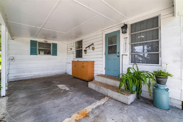 3020 51st Ave E, Bradenton, FL 34203 - doorway to property featuring an attached carport