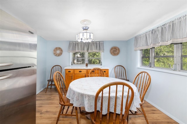 3020 51st Ave E, Bradenton, FL 34203 - dining area with light wood-type flooring and a chandelier