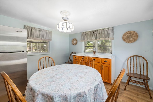 3020 51st Ave E, Bradenton, FL 34203 - dining room featuring a chandelier and light wood-type flooring