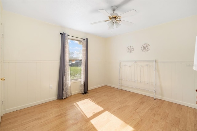 3020 51st Ave E, Bradenton, FL 34203 - empty room featuring wood finished floors, ceiling fan, and wainscoting