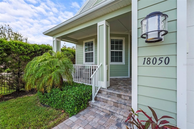 18050 Wooden Skiff Ct, Nokomis, FL 34275 - entrance to property featuring a porch