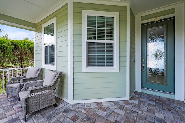 18050 Wooden Skiff Ct, Nokomis, FL 34275 - doorway to property with covered porch