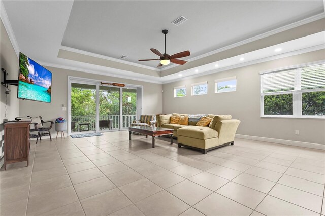 18050 Wooden Skiff Ct, Nokomis, FL 34275 - living area featuring a ceiling fan, a tray ceiling, light tile patterned flooring, crown molding, and recessed lighting