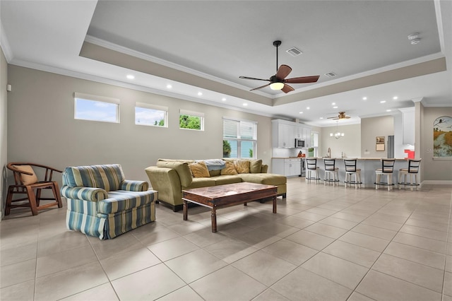 18050 Wooden Skiff Ct, Nokomis, FL 34275 - living area with a raised ceiling, ornamental molding, recessed lighting, a ceiling fan, and light tile patterned floors