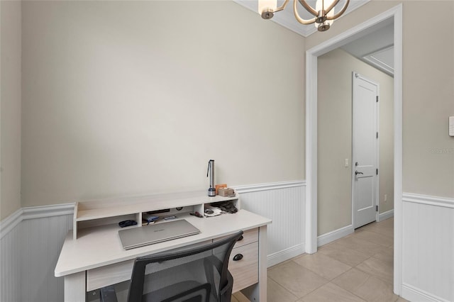18050 Wooden Skiff Ct, Nokomis, FL 34275 - laundry room featuring a wainscoted wall, light tile patterned floors, a chandelier, and a desk