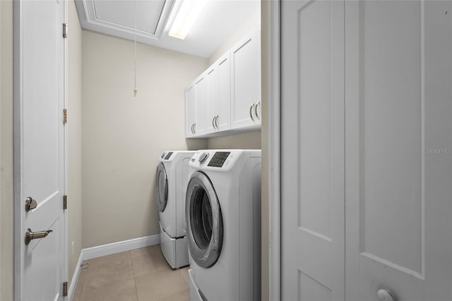 18050 Wooden Skiff Ct, Nokomis, FL 34275 - laundry area with attic access, washing machine and clothes dryer, and cabinet space