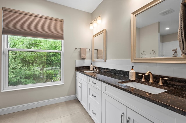 18050 Wooden Skiff Ct, Nokomis, FL 34275 - bathroom with double vanity and tile patterned floors