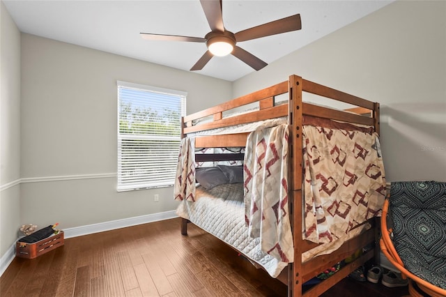 18050 Wooden Skiff Ct, Nokomis, FL 34275 - bedroom featuring wood finished floors and a ceiling fan