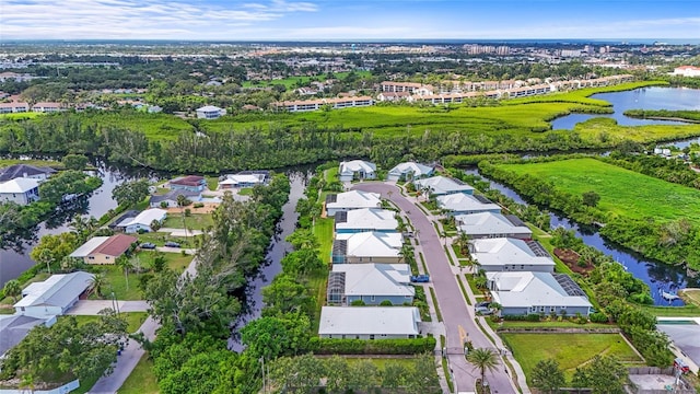 18050 Wooden Skiff Ct, Nokomis, FL 34275 - aerial overview of property's location with a large body of water and nearby suburban area