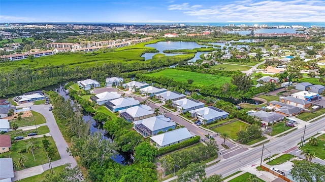 18050 Wooden Skiff Ct, Nokomis, FL 34275 - aerial view of property and surrounding area featuring a nearby body of water and nearby suburban area