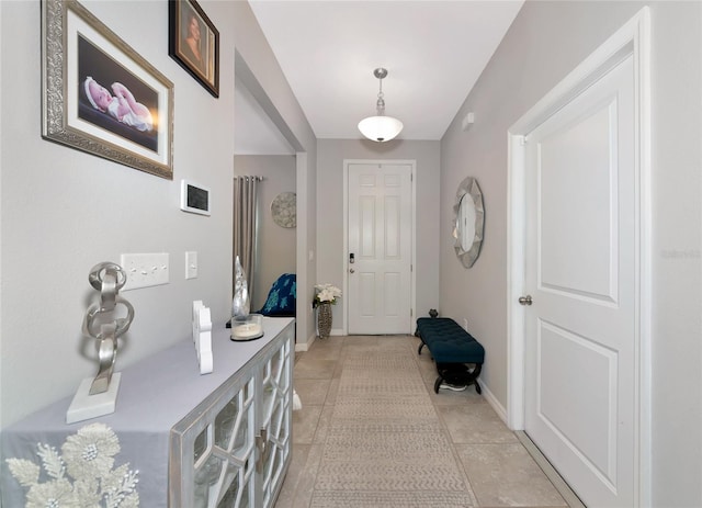 5134 Jackel Chase Dr, Wimauma, FL 33598 - foyer featuring light tile patterned floors and baseboards