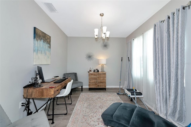 5134 Jackel Chase Dr, Wimauma, FL 33598 - office with a chandelier and light wood finished floors