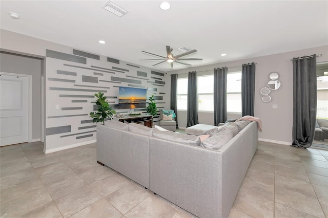 5134 Jackel Chase Dr, Wimauma, FL 33598 - living area featuring a ceiling fan, recessed lighting, an accent wall, and light tile patterned floors