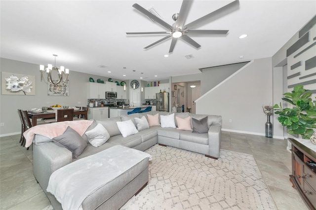 5134 Jackel Chase Dr, Wimauma, FL 33598 - living room with a chandelier, a ceiling fan, and recessed lighting