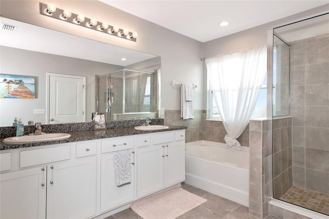 5134 Jackel Chase Dr, Wimauma, FL 33598 - bathroom featuring a stall shower, a bath, double vanity, and tile patterned flooring