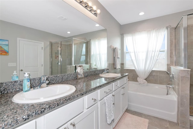 5134 Jackel Chase Dr, Wimauma, FL 33598 - bathroom with a garden tub, a stall shower, double vanity, tile patterned floors, and recessed lighting