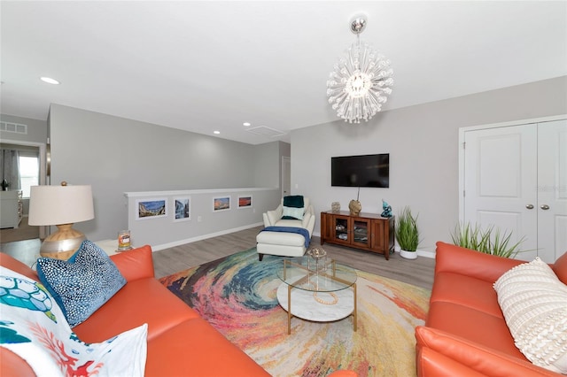 5134 Jackel Chase Dr, Wimauma, FL 33598 - living room with wood finished floors, a chandelier, and recessed lighting