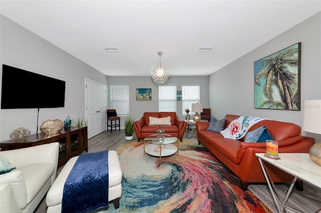 5134 Jackel Chase Dr, Wimauma, FL 33598 - living room with wood finished floors and a chandelier