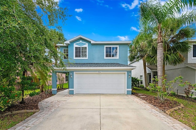 7036 Chatum Light Run, Bradenton, FL 34212 - traditional-style home with stucco siding, concrete driveway, a garage, and a shingled roof