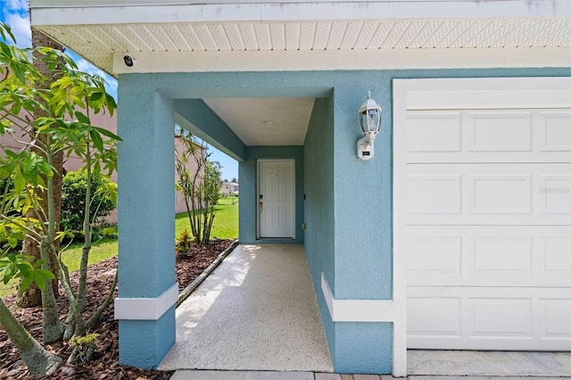 7036 Chatum Light Run, Bradenton, FL 34212 - view of exterior entry featuring stucco siding