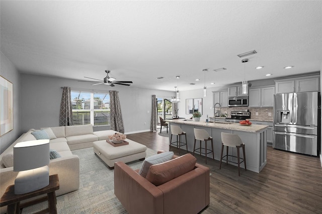 7036 Chatum Light Run, Bradenton, FL 34212 - living room with plenty of natural light, dark wood-style floors, recessed lighting, and ceiling fan