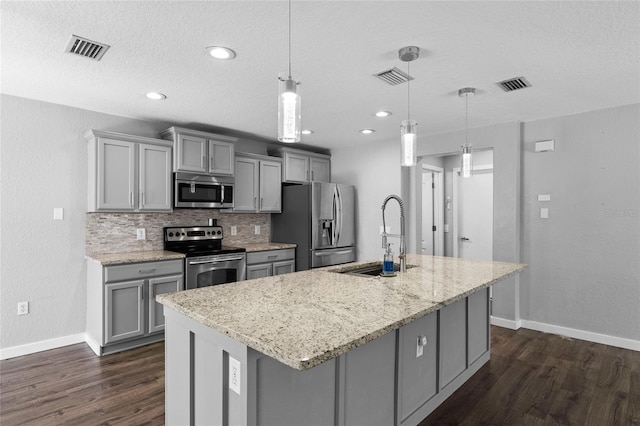 7036 Chatum Light Run, Bradenton, FL 34212 - kitchen featuring stainless steel appliances, gray cabinetry, dark wood-style floors, a textured ceiling, and recessed lighting