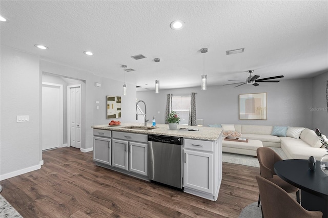 7036 Chatum Light Run, Bradenton, FL 34212 - kitchen featuring stainless steel dishwasher, open floor plan, dark wood-type flooring, hanging light fixtures, and a textured ceiling