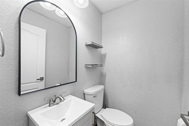 7036 Chatum Light Run, Bradenton, FL 34212 - half bathroom with a textured wall and vanity