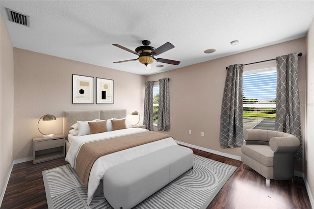 7036 Chatum Light Run, Bradenton, FL 34212 - bedroom featuring wood finished floors, a textured ceiling, and a ceiling fan