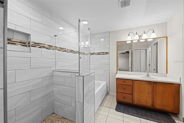 7036 Chatum Light Run, Bradenton, FL 34212 - bathroom featuring vanity, tile patterned floors, and a textured ceiling