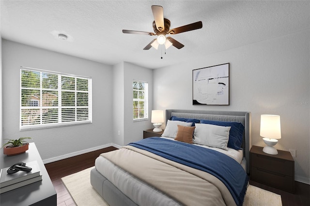 7036 Chatum Light Run, Bradenton, FL 34212 - bedroom featuring wood finished floors, ceiling fan, and a textured ceiling