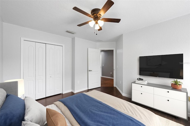 7036 Chatum Light Run, Bradenton, FL 34212 - bedroom with dark wood-style floors, a closet, and ceiling fan