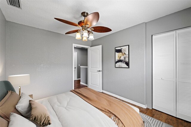 7036 Chatum Light Run, Bradenton, FL 34212 - bedroom with a closet, wood finished floors, and ceiling fan