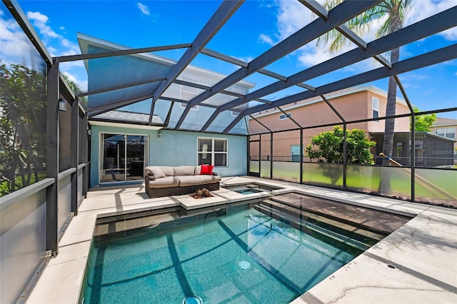 7036 Chatum Light Run, Bradenton, FL 34212 - view of swimming pool with glass enclosure, a patio area, and a pool with connected hot tub