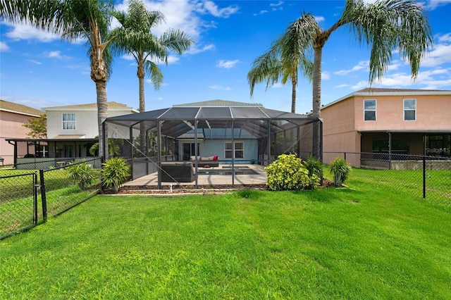 7036 Chatum Light Run, Bradenton, FL 34212 - back of property featuring a fenced backyard, a patio, and a lanai