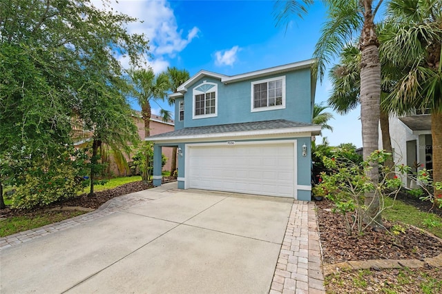 7036 Chatum Light Run, Bradenton, FL 34212 - traditional-style house featuring stucco siding, an attached garage, concrete driveway, and roof with shingles