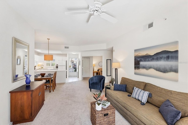 8335 Glenrose Way Unit 1513, Sarasota, FL 34238 - living room featuring light carpet and a ceiling fan
